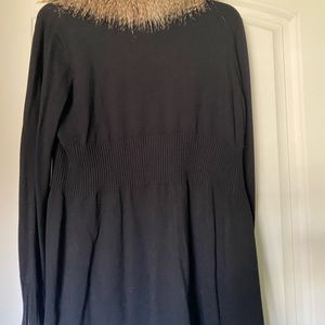 Black sweater with faux fur removable collar zipper front and sleeves.